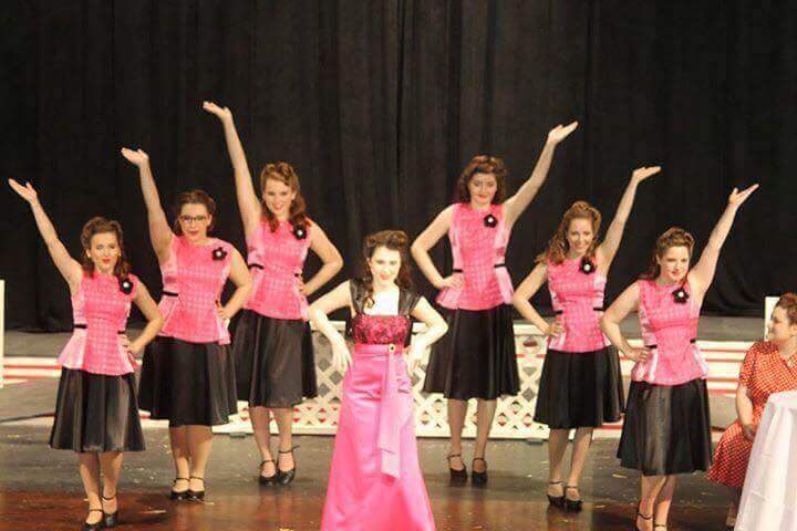 Abigail (third from left) and her fellow Fair Tones provide the backup for Emily Arden in the high school's production of State Fair.